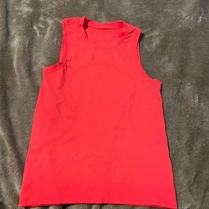 Lululemon Orange Muscle Tank Swiftly. Worn twice. Size 2-4 will fit.